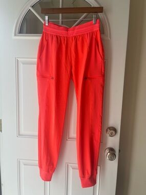 Cherokee infinity Women's scrub joggers in Bright orange with pink detail